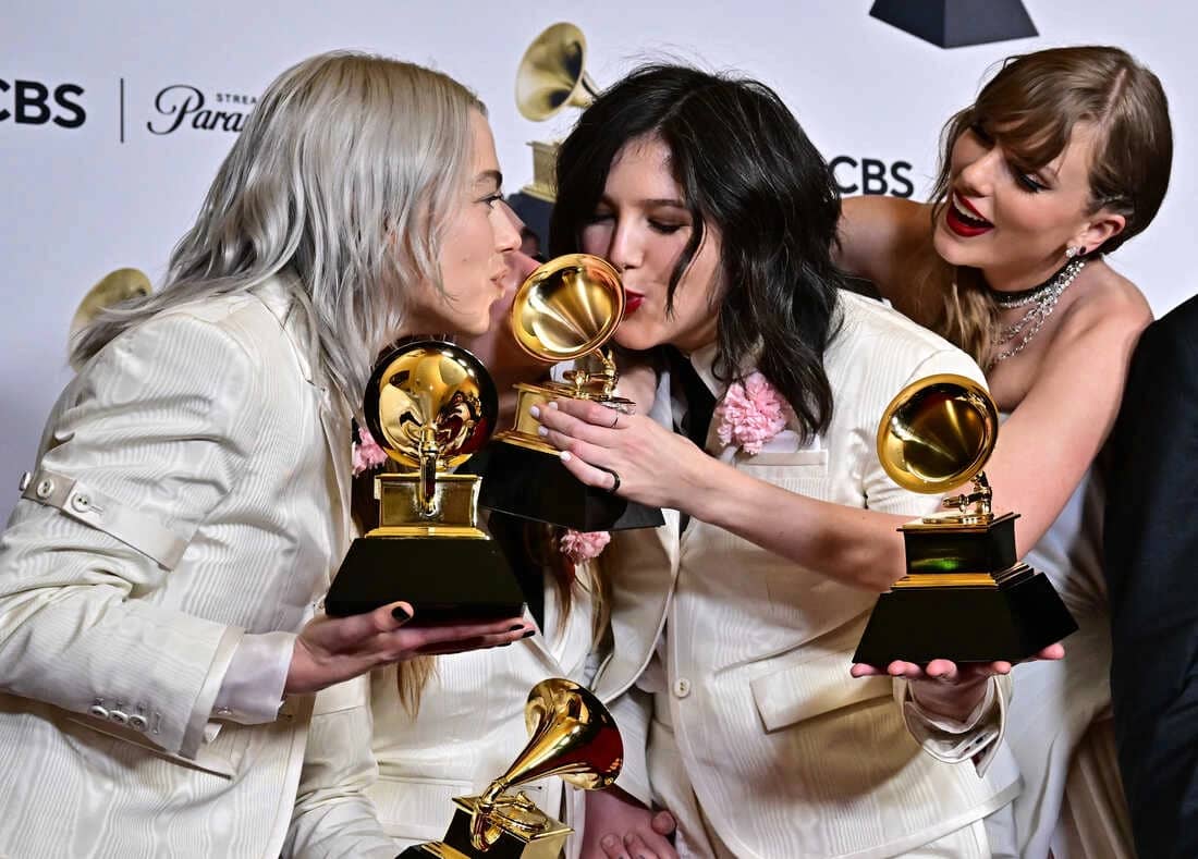 Artist receiving a Grammy Award trophy at the 2024 ceremony.