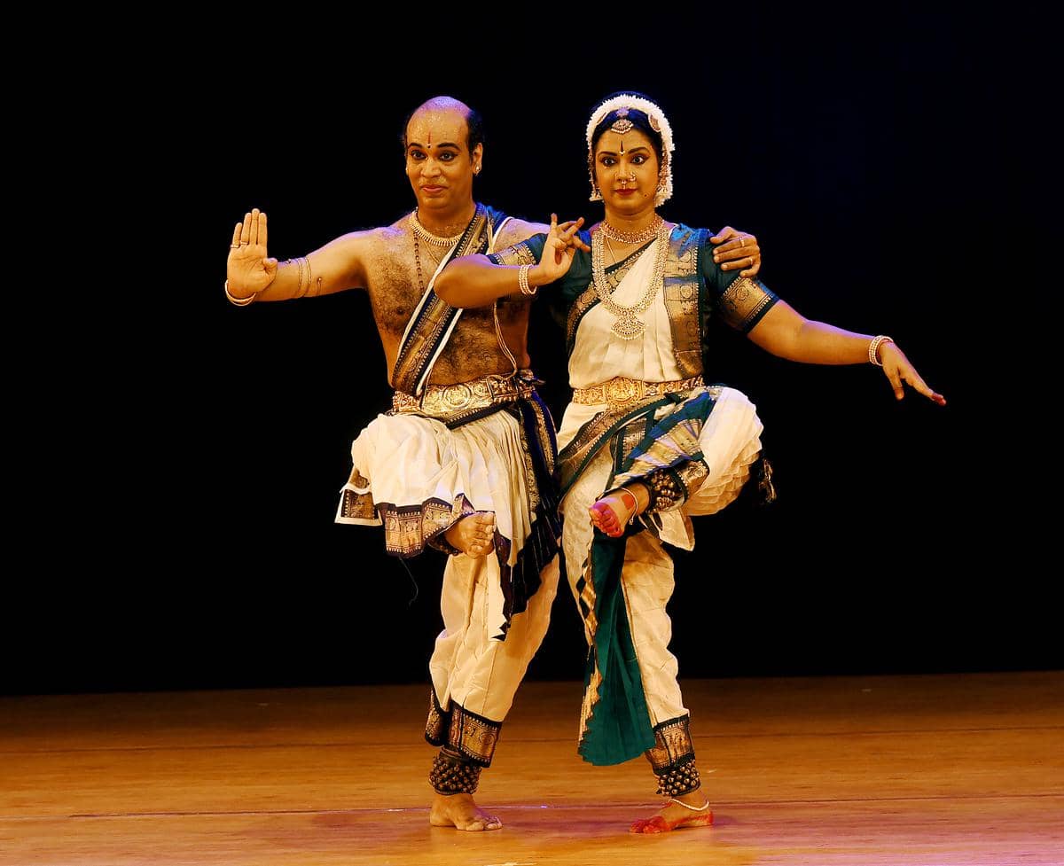 Kuchipudi dancer performing intricate footwork on stage