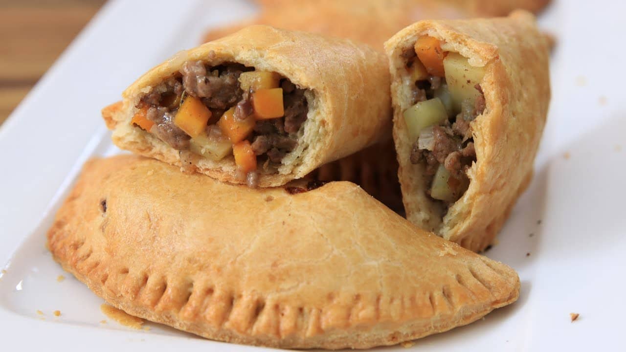 Jamaican meat patties with a spicy filling and flaky turmeric crust.