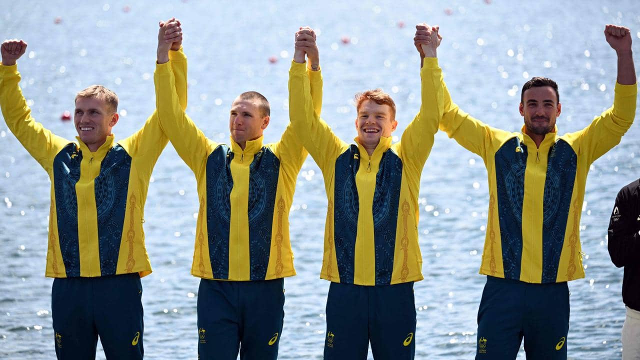 Australian athlete celebrating gold medal win at Paris 2024 Olympics.