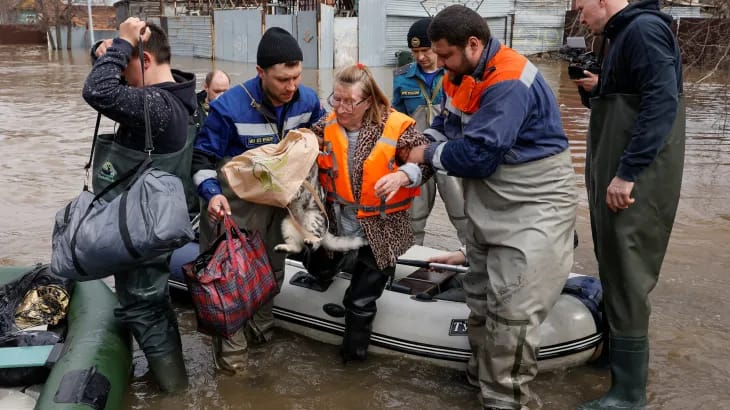 Collapsed bridge and washed-out roads as a result of devastating floods in both countries