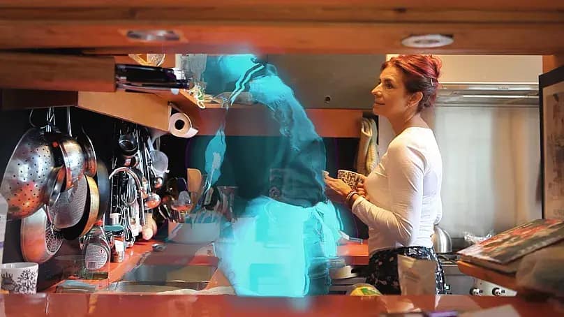 Artist holding hands with their AI-hologram partner, symbolizing their unique and groundbreaking marital union.