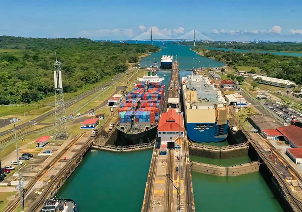 Aerial view of the Panama Canal, showcasing its intricate locks and surrounding landscape.
