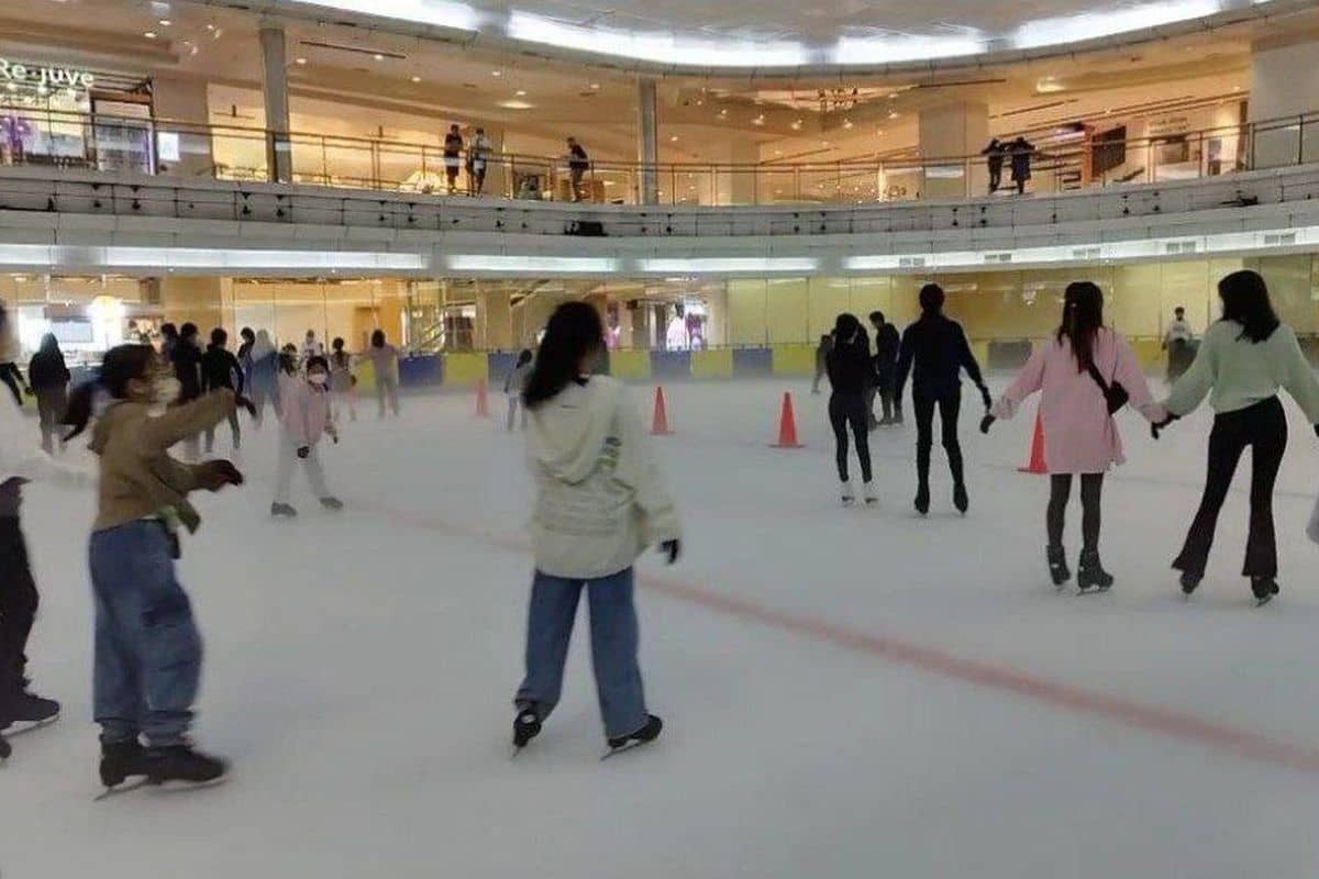A figure skater gracefully gliding across the ice, performing elegant spins and jumps